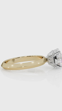 Close-up of a custom engagement ring by lessard coutu jewellery called L'Athénienne featuring highly detailed yellow gold handcrafted band and a brilliant diamond set in a delicate, handcrafted band.